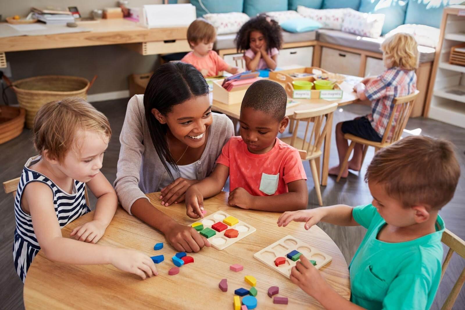 Preschool children and teacher interacting in a Head Start classroom